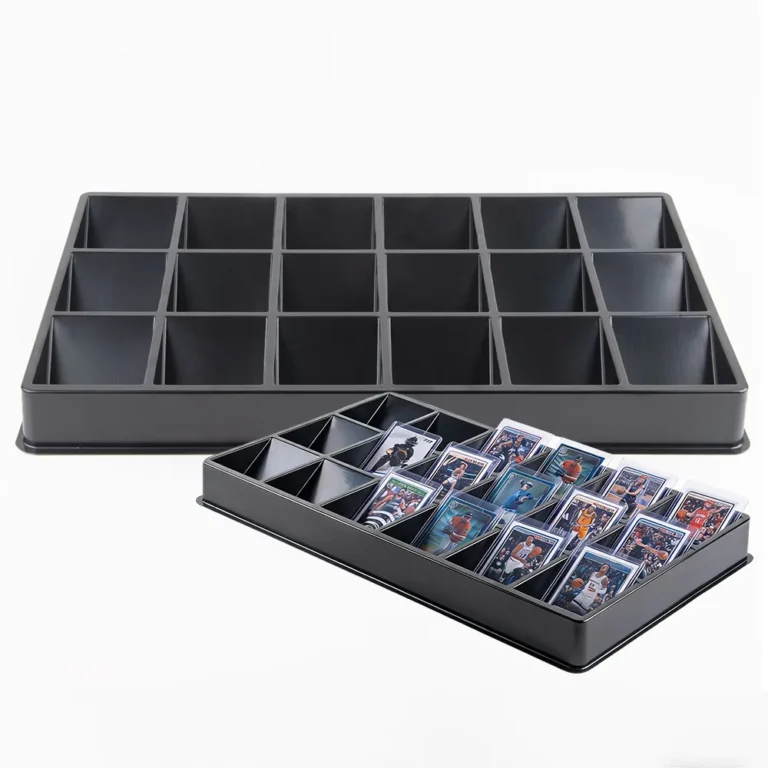 Two black plastic 18‑grid trays, one empty unit and one tray filled with toploader‑protected trading cards, OEM ODM factory for bulk resellers
