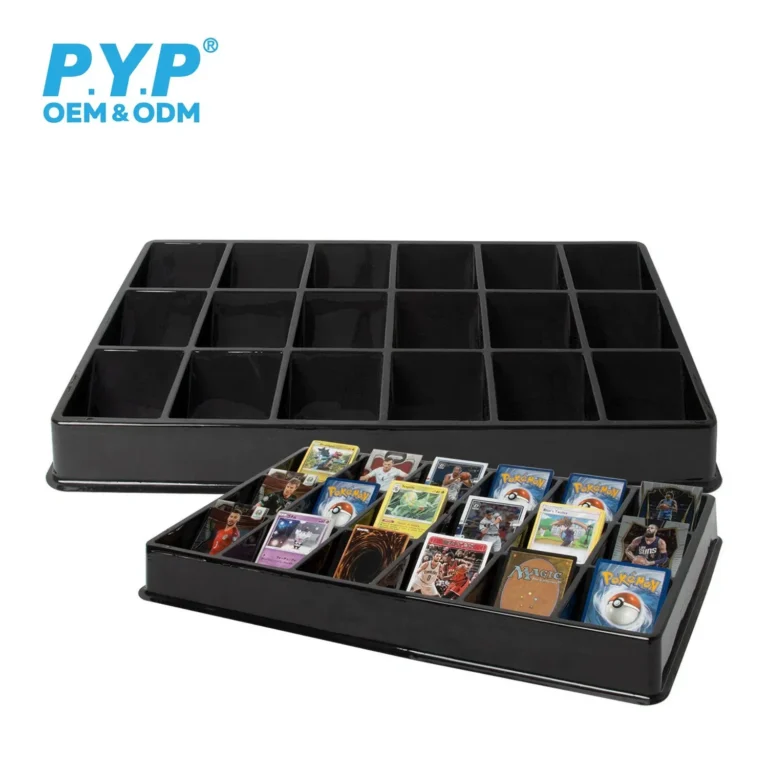 Overhead top view of blank 18‑slot black TCG sorting tray, clearly show all divided square compartments and partition walls
