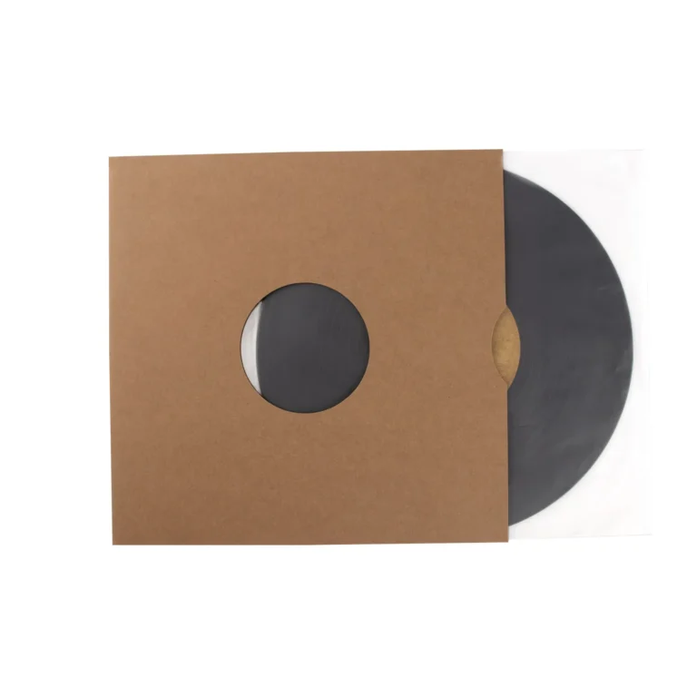 Top‑down flat view of blank cardboard LP outer jacket placed beside complete 12‑inch vinyl LP set